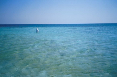 Alone, alone... Bernie Rauch fishing just off the sand island