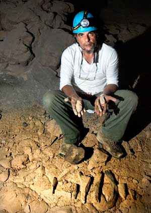 Mahmoud with basalt fragments - Photo by John Pint