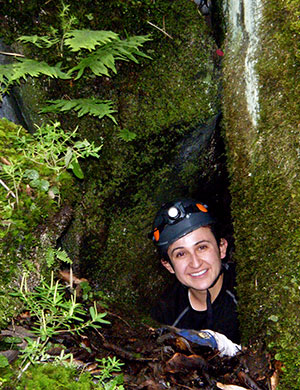 Archaeologist Cinthia M. Campos exiting cave. Photo Luis Rojas