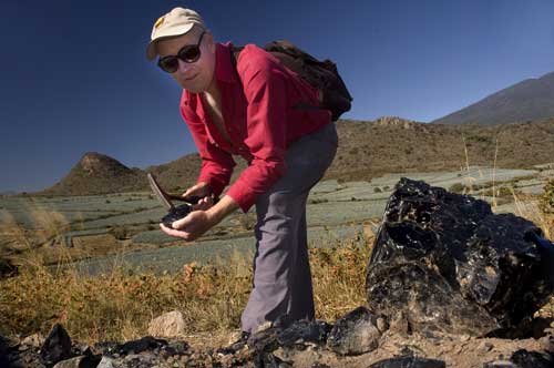 Canadian geologist Chris wields his rock hammer at El Pedernal